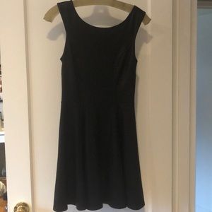 Black dress. Slightly shiny.